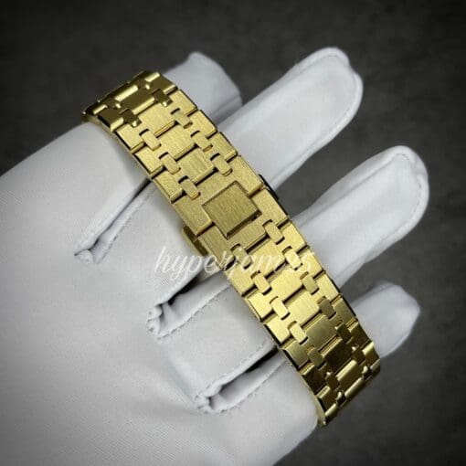 Sophisticated gold-toned full stainless steel bracelet watch with a completely black face and vibrant rainbow indices