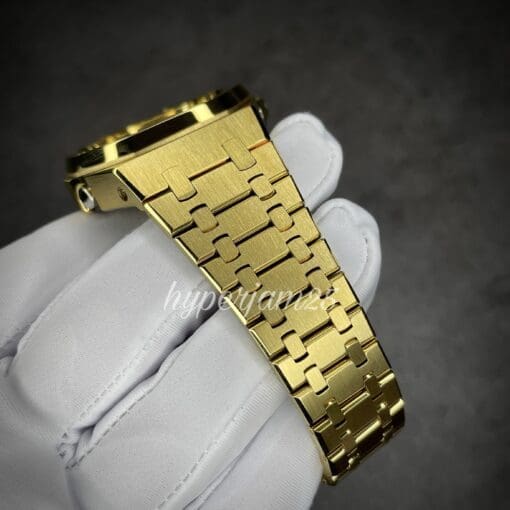 Elegant men's watch showcasing a gold stainless steel band, a deep black dial, and eye-catching rainbow hour markers.