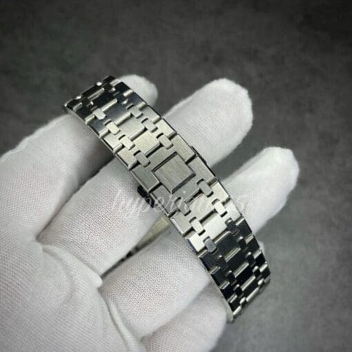 Modern and stylish watch modification of the Casioak, highlighting its colorful rainbow hour index, black bezel, and durable stainless steel bracelet.